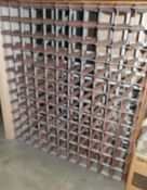 A wine rack with places for 131 bottles.