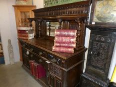 A large Victorian oak mirror backed sideboard.