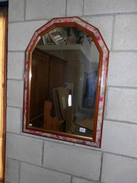 A modern wall mirror.