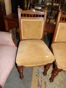 A set of 4 Edwardian oak dining chairs.