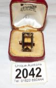 A vintage oblong smoky quartz ring stamped 9ct gold, size O.