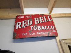 An enamel sign for Red Bell tobacco (approximately 29.25" x 20").