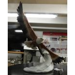A limited edition hand painted sculpture of a bald eagle by Kaiser, signed by artist,