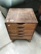 An Edwardian office filing chest of drawers on Queen Anne legs