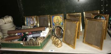 A quantity of gilded photo frames, vintage playing cards, 1970's Yorkshire slides etc.