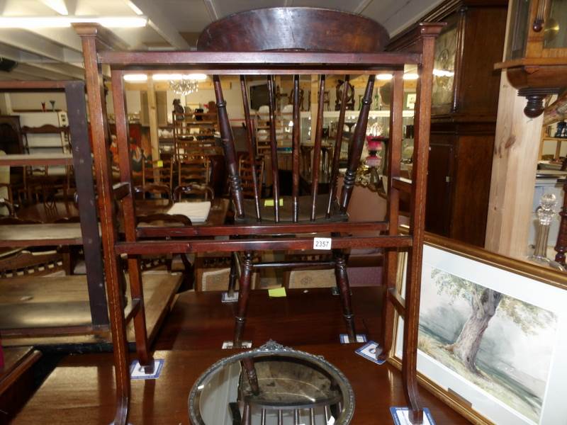 A Victorian mahogany inlaid towel rail.