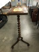A Victorian rosewood barley twist tripod plant stand with tile inset top.