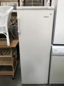 A Frigidaire upright freezer