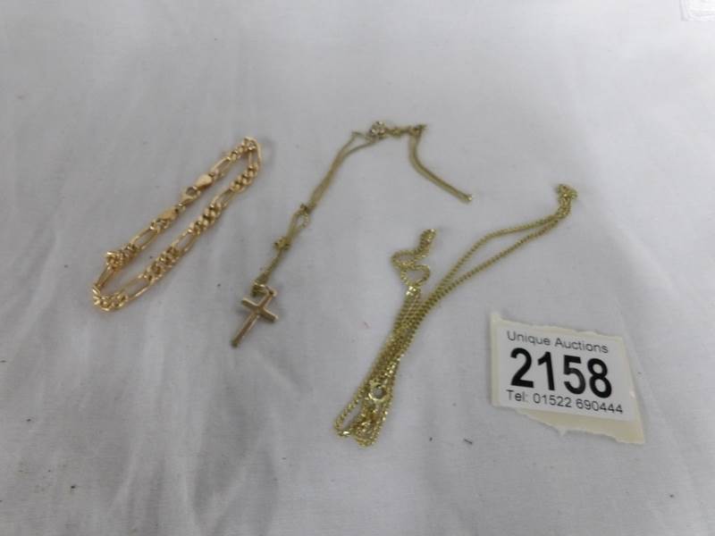 A 9ct gold cross on chain, a 9ct gold chain and a 9ct gold bracelet. Approximately 10 grams.