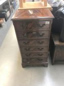 A mahogany finished 6 drawer chest of drawers