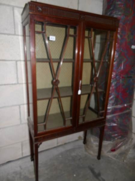 An Edwardian display cabinet.