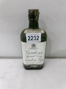 A small bottle of Gordon's special dry London gin.