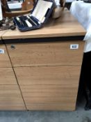 A 3 drawer teak effect office chest