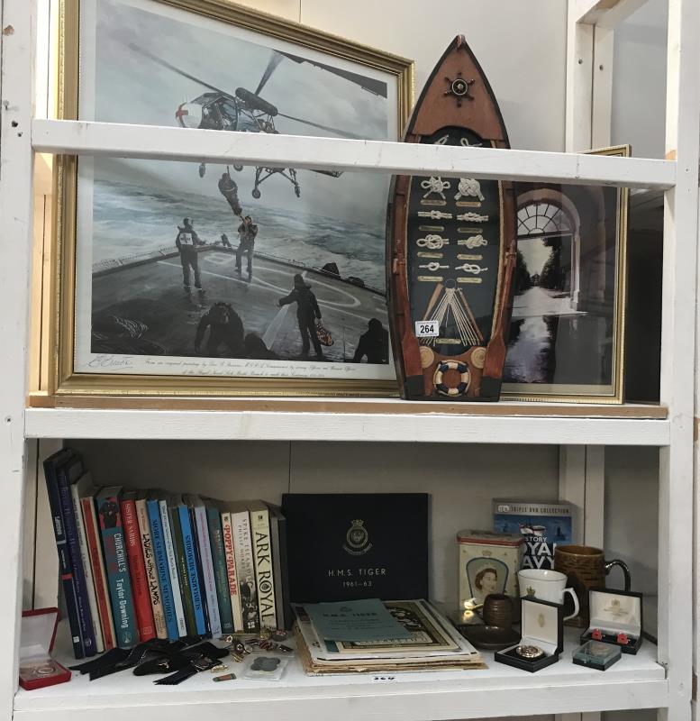A collection of books and memorabilia relating to the Royal Navy and V.A.D.