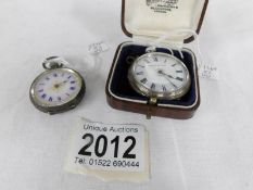 A ladies silver pocket watch (hour hand missing) and an 800 ladies silver pocket watch.