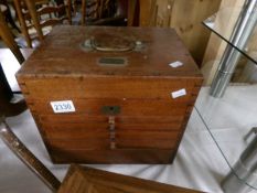 An oak dentist tool cabinet and contents 'The Glasgow Dental Depot'