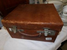 A vintage gentleman's travel vanity case with fittings.