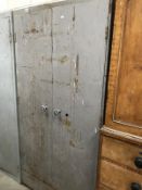 An industrial 2 door metal cabinet