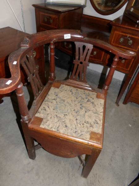 A 19th century oak corner chair.