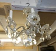 A 5 lamp glass chandelier.