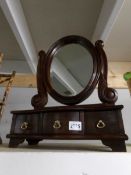 A mahogany toilet mirror with drawers to base.