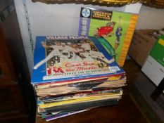 A mixed lot of LP records including Village People etc.