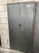 An industrial 2 door metal cabinet