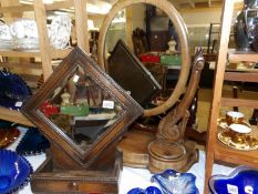 A Victorian mahogany toilet mirror and a later oak wall mirror.