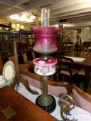 A Victorian oil lamp on pot base with reeded column,