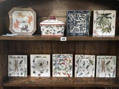 A quantity of stoneware glazed dishes depicting insects