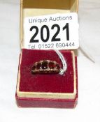 An 18ct gold ring set rubies and diamonds.