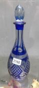 A blue Bohemian cut glass decanter.