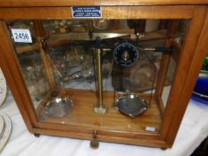 A cased set of apothecary scales by Griffin & George Ltd.