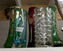 5 glass vases in various designs and colours.