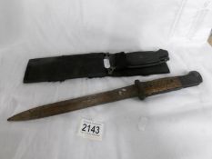 A second world ware German style bayonet (markings heavily worn) and a dagger.