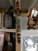A large wooden crucifix with metal figure of Christ.