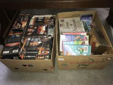 2 boxes of videos - Approximately 58 - including James Bond 007,