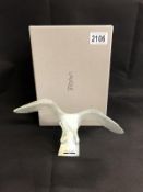 A boxed Lalique opalescent eagle with outspread wings.