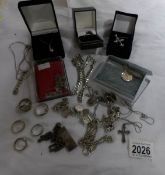 A collection of silver jewellery including rings, pendants, charm bracelet, ingot etc.