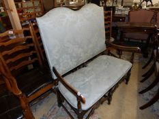 A 2 seater high back settee with mahogany frame.