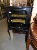 A Victorian ebonised display cabinet.