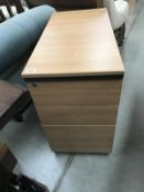 A 3 drawer pine effect office chest
