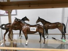 3 Beswick brown horses including one with label 'Modelled from Bois Roussel 1938 Derby Winner'.