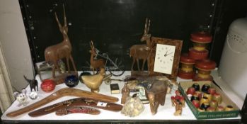 A quantity of wooden animals and boomerangs etc.