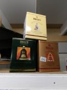 3 boxed Bell's whisky bells with contents.