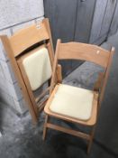 2 lightwood folding chairs