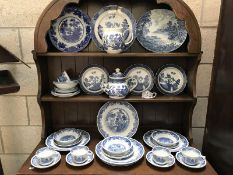 A large quantity of blue willow china including Masons, Ridgeways etc.