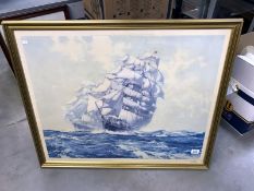 A framed and glazed print of racing galleon ships in full sail