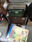 A box of assorted LP records including Elton John, The Police, Eric Clapton, Gryphon Simply Red,