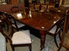 A Victorian mahogany wind out extending dining table with handle.